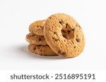 Group of classic shortbread biscuits with chocolate chips, circular biscuits with a hole in the center, typically crumbly and slightly golden on the surface, made with simple ingredients like flour, b