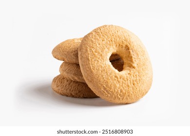 Group of classic shortbread biscuits. Circular biscuits with a hole in the center, typically crumbly and slightly golden on the surface, made with simple ingredients like flour, butter, and sugar