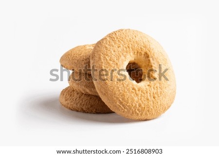 Group of classic shortbread biscuits. Circular biscuits with a hole in the center, typically crumbly and slightly golden on the surface, made with simple ingredients like flour, butter, and sugar