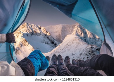 Group Of Climber Are Inside A Tent With Open For View Of Blizzard On Snow Mountain