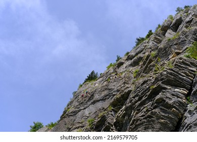 Group Of Climbers Climbing Rock, Active Lifestyle Of People, Mountaineering, Via Ferrata In Mountains Of Alps In Summer, Life Insurance In Extreme Sports, Team Support, Achievement Extreme Sport