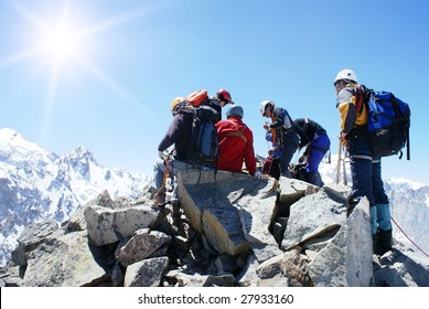 Group Of Climbers On The Top Of Mountain