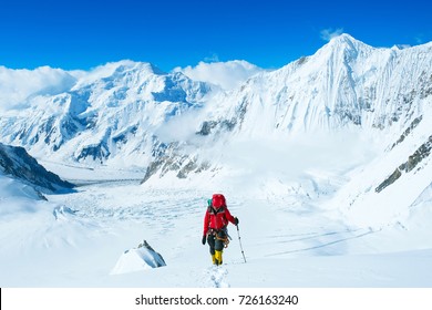 Group of climbers reaches the summit of mountain peak. Success, freedom and happiness, achievement in mountains. Climbing sport concept. - Shutterstock ID 726163240