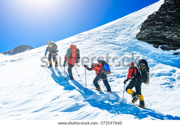 Group Climbers Reaching Summit Stock Photo (Edit Now) 373597660