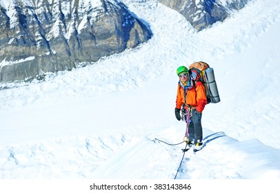 Group of  climbers reaching the summit, Nepal Himalayas - Shutterstock ID 383143846