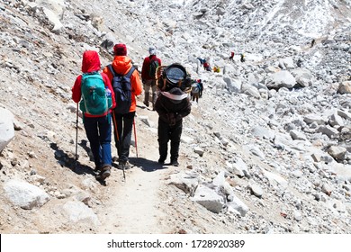 Group Of Climbers In Snow Mountains. Team Work Concept. Sagarmatha National Park, Trek To Everest Base Camp - Nepal Himalayas.