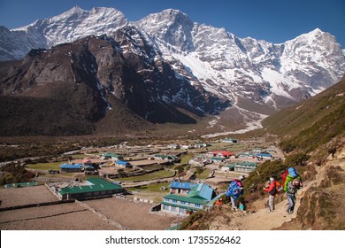 Group Of Climbers In Snow Mountains. Team Work Concept. Sagarmatha National Park, Trek To Everest Base Camp - Nepal Himalayas.