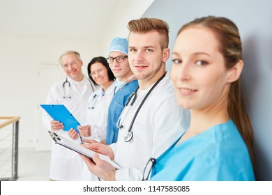 Group Of Clinic Doctors Or Therapists With Surgical Nurse In Training