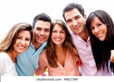 Group Of Close Friends Smiling Outdoors And Hugging