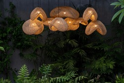 Group Cluster Of Rattan Lampshades In The Tropical Garden In Evening Lights On 