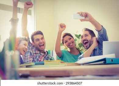 Group Of Colleagues Taking A Selfie In The Office