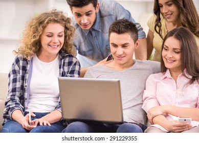 Group Of College Students Resting Together At Common Room.