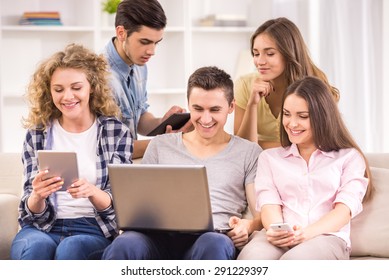 Group Of College Students Resting Together At Common Room.