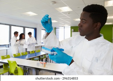 Group Of College Students In Science Class With Experiment