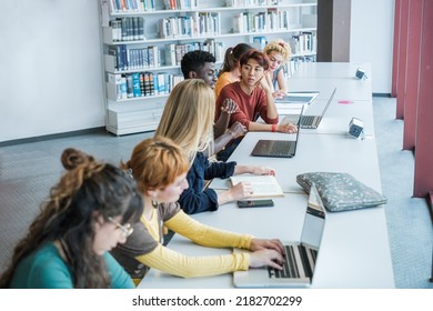 Group of college students studying at university - focus on young asian man - Shutterstock ID 2182702299