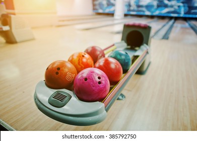 A group of colored bowling balls at bowl lift