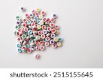 Group of colorful beads with letters to make necklaces and bracelets