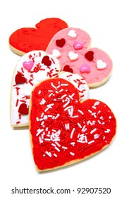 Group Of Colorful Heart-shaped Valentines Day Cookies With Icing Over White