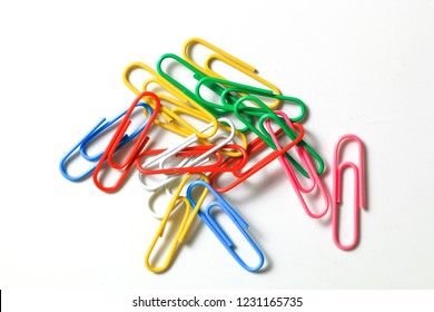 Group of colorful paperclips, cluster isolated on white background