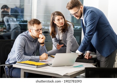 Group of company coworkers  at the office  discuss about  business strategy of  new investments. - Powered by Shutterstock