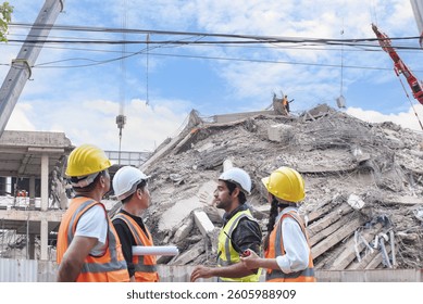 Group of construction engineers evaluates structural damage at a collapsed building site during post-disaster recovery and investigation process.