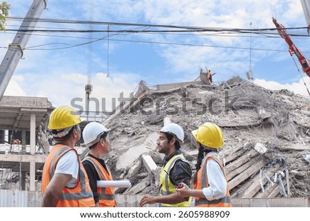 Group of construction engineers evaluates structural damage at a collapsed building site during post-disaster recovery and investigation process.