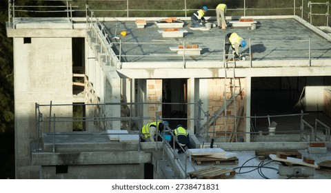  Group of Construction Workers at Work on a Large Construction Site Constructing a Concrete Floor