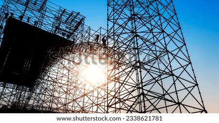 Group of construction workers working on scaffolding