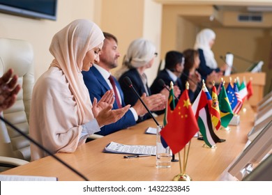 Group Of Contemporary Intercultural Delegates Clapping Hands