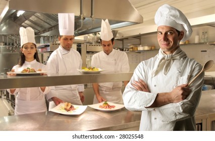 group of cooks in a kitchen - Powered by Shutterstock