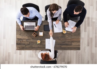 Group Of Corporate Recruitment Officers Shaking Hand With Candidate Arrived For Interview - Shutterstock ID 678279070