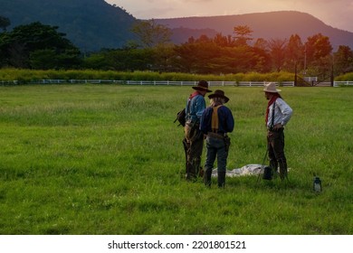 Group Of Cowboys Outdoors Camping.Cowboy With Campfire.