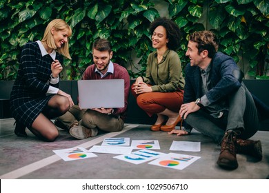 Group Of Coworkers Having A Casual Meeting Outside The Office