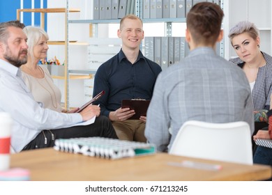 Group Of Coworkers Immersed In A Deep Conversation