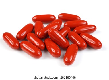 A Group Of Cranberry Fruit Soft Gel Capsules On White.