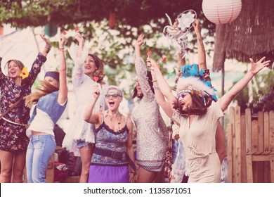 Group Of Crazy Women Mixed Ages From Young To Old Having Fun And Dancing All Together In A Hippy Style Event. Celebrating Group People Concept With Colored Clothes And Happiness