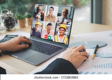 Group Of Creative Construction Engineer Using Laptop For Video Conference Meeting And Discussion About New Project. Work From Home, Working Remotely During Corona Virus Crisis, New Normal Working.