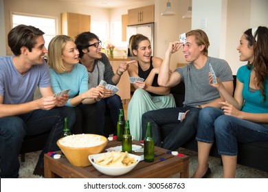 Group Crowd Of People Friends At Home In Dorm Playing Games Cards Poker Excited