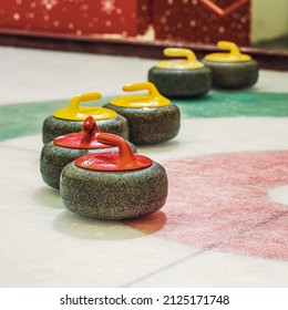 Group of curling rocks on ice close-up