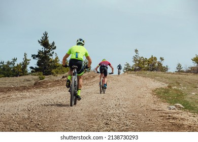 Group Cyclist Biking Mountain Bike On Uphill