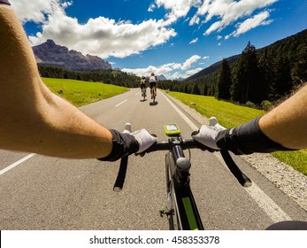 Group Of Cyclist On Mountaionous Road. Original Point Of View POV, View In First Person. Focus On Hands Of Cyclist,