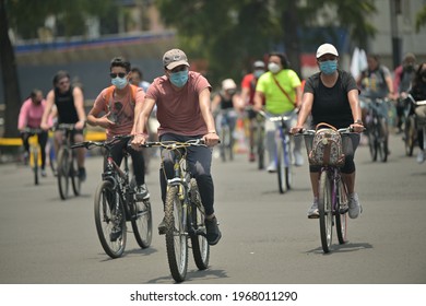 
Group Of Cyclists With Face Masks On Reforma Avenue. Mexico City, Mexico May 2, 2021