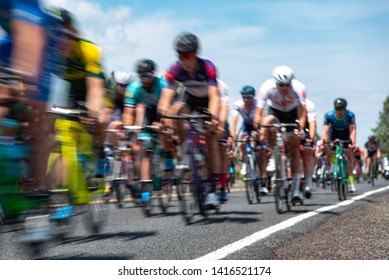 Group Of Cyclists In A Road Race Stage.