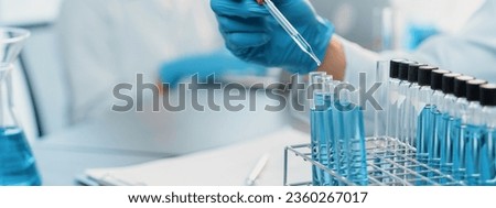 Group of dedicated scientist conduct chemical experiment in medical laboratory, carefully drop precise amount of liquid from pipette into test tube for vaccine drug or antibiotic development. Neoteric ストックフォト © 