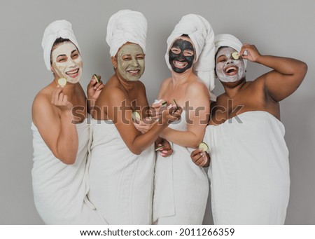 Similar – Multiethnic women with face masks taking selfie