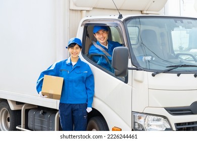 Group of delivery staff with transport truck. home delivery. Logistics worker. - Powered by Shutterstock