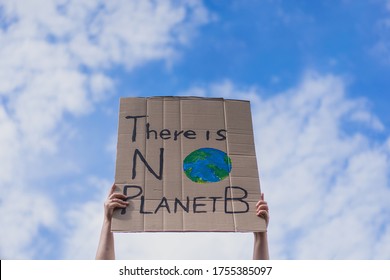 Group of demonstrators on road. Activists protesting on social issues. Race fight and climate change protesting activist during lockdown. global warming and environmental issues. Activists protesting - Powered by Shutterstock