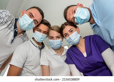 Group Of Dentists Holding Medical Instruments And Stant In A Circle At A Meeting. Patient Hospital