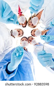 Group Of Dentists Holding Medical Instruments At The Hospital