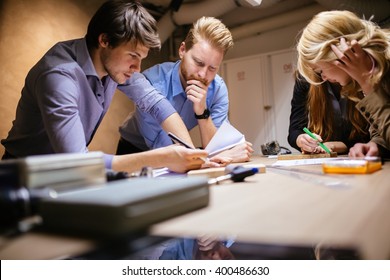 Group of designer working on project in workshop - Powered by Shutterstock